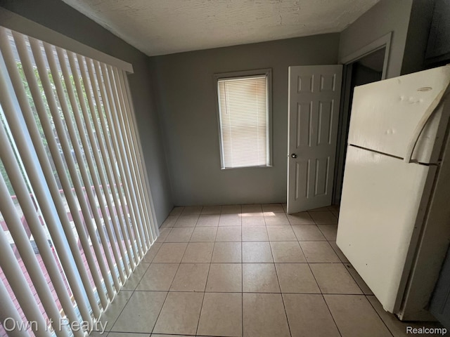 8620 Fielding St, Detroit, MI 48228 - unfurnished dining area featuring light tile patterned flooring