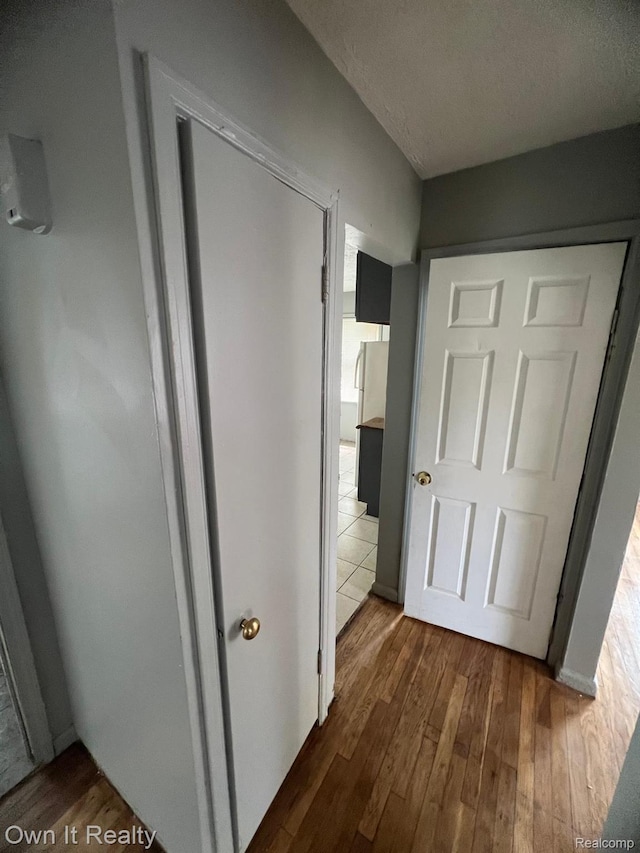 8620 Fielding St, Detroit, MI 48228 - corridor with dark wood-style flooring and a textured ceiling