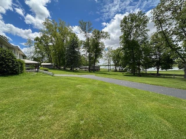 395 Hyannis Hills Dr, Tekonsha, MI 49092 - surrounding community featuring a lawn