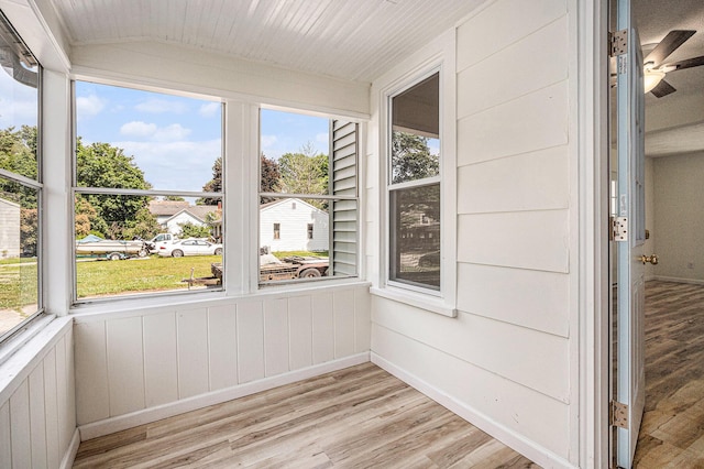 556 Union St, Niles, MI 49120 - unfurnished sunroom featuring wood finished floors, plenty of natural light, a ceiling fan, and wood walls