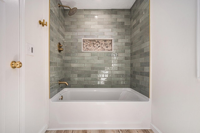 556 Union St, Niles, MI 49120 - full bathroom with wood finished floors and washtub / shower combination