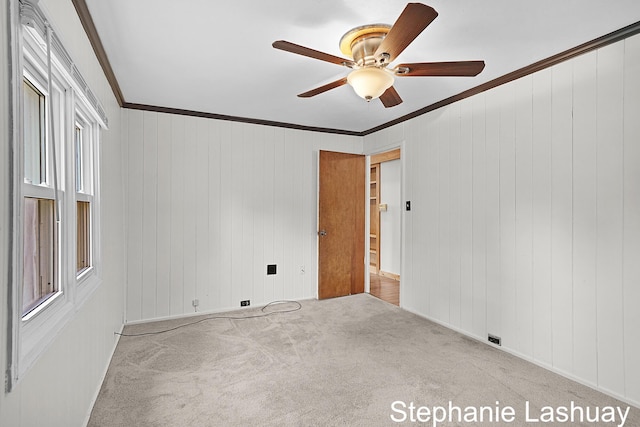 169 S Linda St NE, Cedar Springs, MI 49319 - carpeted spare room featuring a ceiling fan, crown molding, and plenty of natural light
