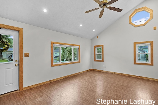 169 S Linda St NE, Cedar Springs, MI 49319 - foyer entrance with wood finished floors, plenty of natural light, recessed lighting, ceiling fan, and high vaulted ceiling