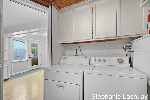 169 S Linda St NE, Cedar Springs, MI 49319 - laundry area with cabinet space, separate washer and dryer, and light wood-type flooring
