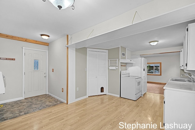 169 S Linda St NE, Cedar Springs, MI 49319 - washroom featuring light wood-style floors