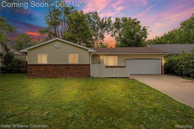 3123 W Utica Rd, Shelby Twp, MI 48317 - view of front of house featuring brick siding, a garage, concrete driveway, and a lawn