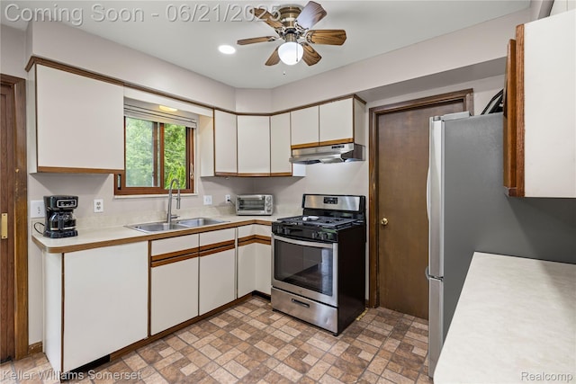 3123 W Utica Rd, Shelby Twp, MI 48317 - kitchen with appliances with stainless steel finishes, under cabinet range hood, light countertops, and white cabinetry