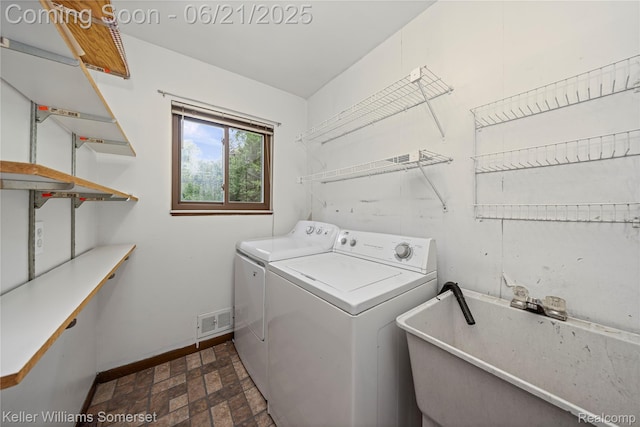 3123 W Utica Rd, Shelby Twp, MI 48317 - laundry area with independent washer and dryer and brick patterned flooring