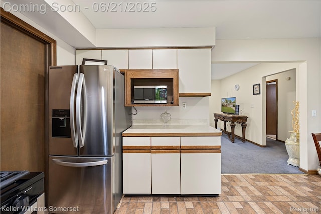 3123 W Utica Rd, Shelby Twp, MI 48317 - kitchen with stainless steel appliances, light countertops, white cabinets, and light colored carpet
