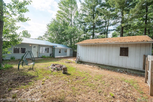 106 Devonshire Dr, Prudenville, MI 48651 - view of yard with a fire pit