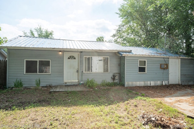 106 Devonshire Dr, Prudenville, MI 48651 - view of front of house featuring a metal roof