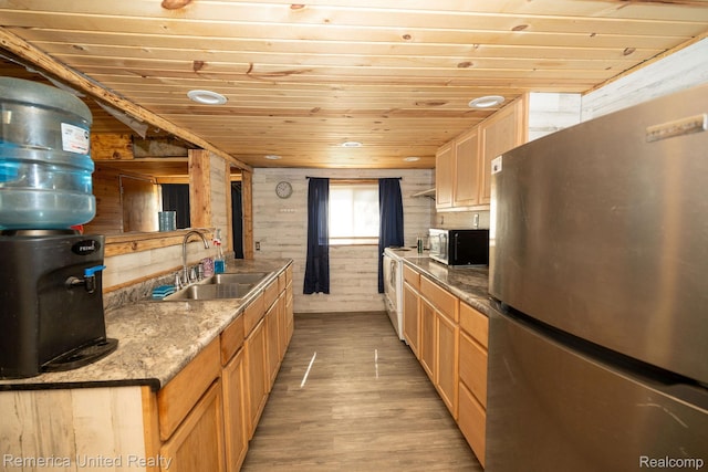 106 Devonshire Dr, Prudenville, MI 48651 - kitchen with appliances with stainless steel finishes, wooden ceiling, light wood-style floors, and wooden walls