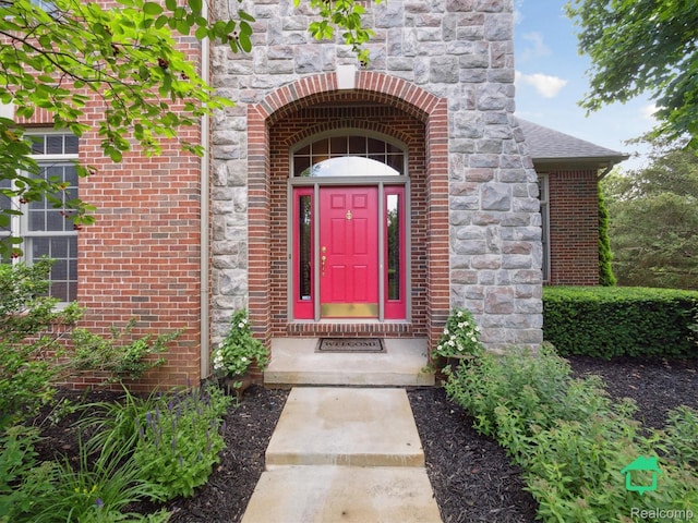 6345 Brookview Dr, Saline, MI 48176 - doorway to property featuring brick siding and stone siding