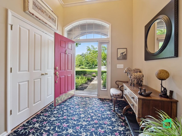 6345 Brookview Dr, Saline, MI 48176 - foyer entrance featuring carpet flooring and ornamental molding