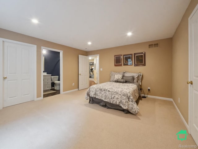 6345 Brookview Dr, Saline, MI 48176 - bedroom with light carpet, recessed lighting, and connected bathroom