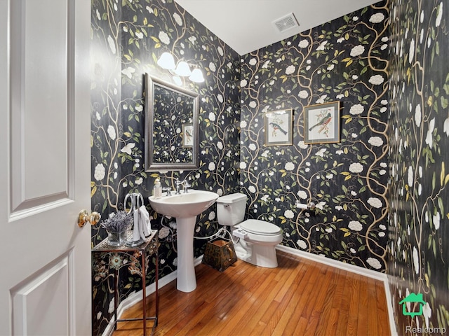 6345 Brookview Dr, Saline, MI 48176 - half bath featuring wallpapered walls and wood-type flooring