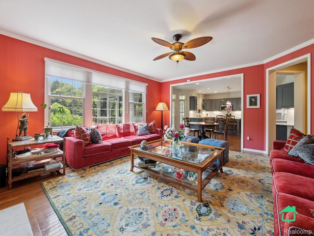 6345 Brookview Dr, Saline, MI 48176 - living area featuring crown molding, ceiling fan, and wood finished floors