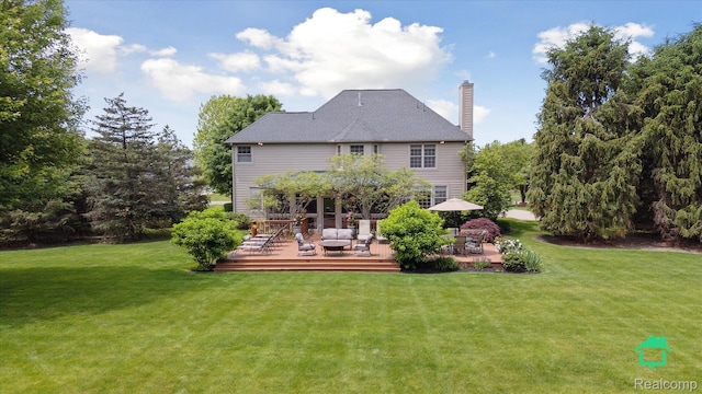 6345 Brookview Dr, Saline, MI 48176 - rear view of house featuring a yard, a deck, and a chimney