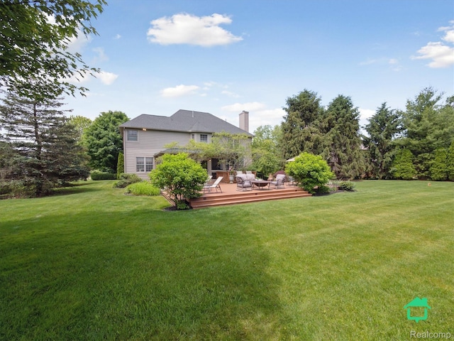 6345 Brookview Dr, Saline, MI 48176 - view of green lawn with a wooden deck