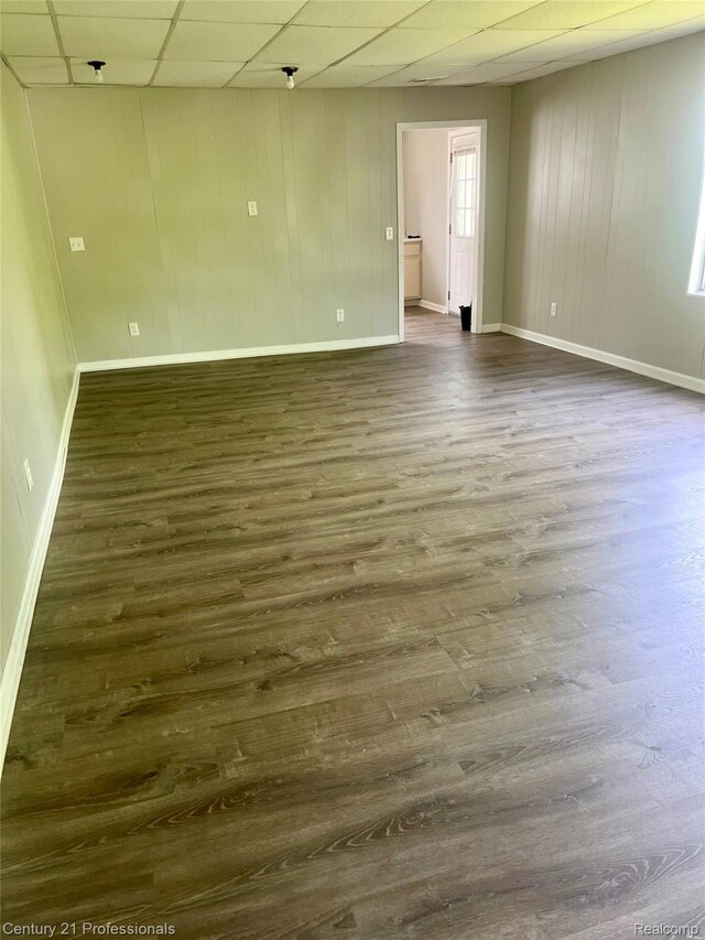 14463 Leonard Ave, Warren, MI 48089 - empty room with a drop ceiling and dark wood finished floors