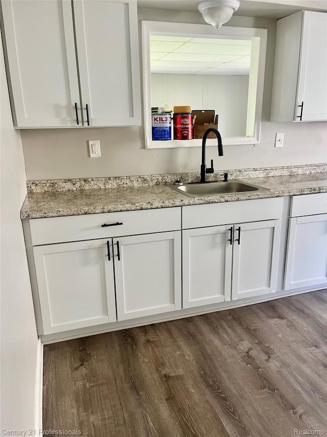 14463 Leonard Ave, Warren, MI 48089 - kitchen with white cabinetry and dark wood-type flooring
