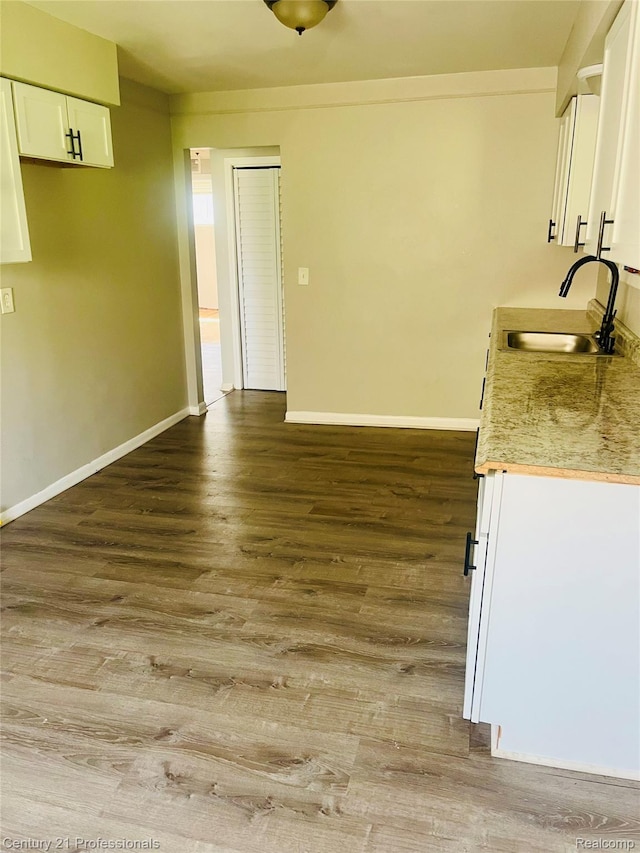 14463 Leonard Ave, Warren, MI 48089 - kitchen with white cabinets, wood finished floors, and light countertops