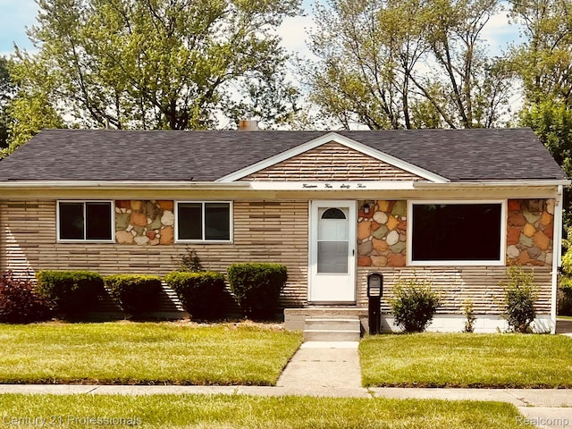 14463 Leonard Ave, Warren, MI 48089 - view of front of house featuring stone siding, a shingled roof, and a front lawn