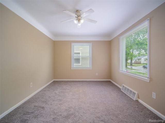 25457 Andover Dr, Dearborn Heights, MI 48125 - spare room featuring healthy amount of natural light, carpet flooring, and a ceiling fan