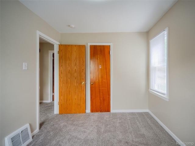 25457 Andover Dr, Dearborn Heights, MI 48125 - unfurnished bedroom featuring carpet floors and multiple windows