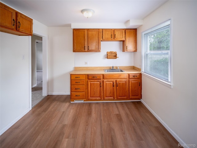 25457 Andover Dr, Dearborn Heights, MI 48125 - kitchen featuring dark wood finished floors, brown cabinets, and light countertops