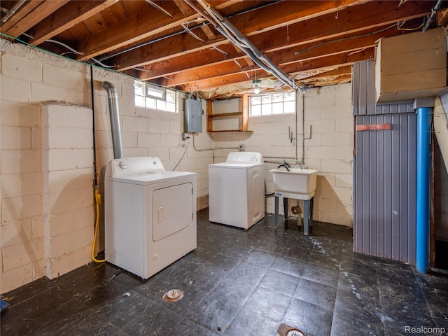 25457 Andover Dr, Dearborn Heights, MI 48125 - laundry area featuring washer and dryer, electric panel, and dark flooring