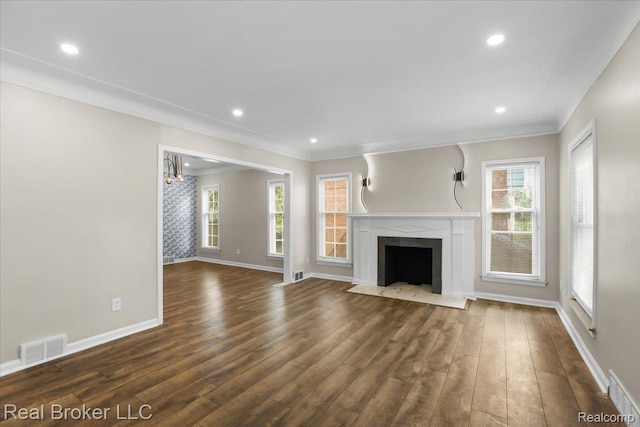 15873 Kentfield St, Dearborn, MI 48223 - unfurnished living room with ornamental molding, dark wood finished floors, healthy amount of natural light, a fireplace with flush hearth, and a chandelier