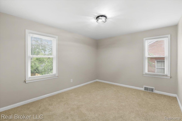 15873 Kentfield St, Dearborn, MI 48223 - carpeted empty room featuring plenty of natural light