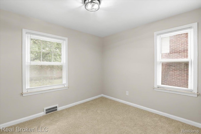15873 Kentfield St, Dearborn, MI 48223 - carpeted empty room featuring baseboards