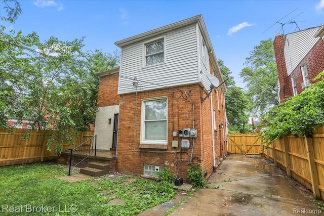 15873 Kentfield St, Dearborn, MI 48223 - rear view of house with brick siding and a fenced backyard