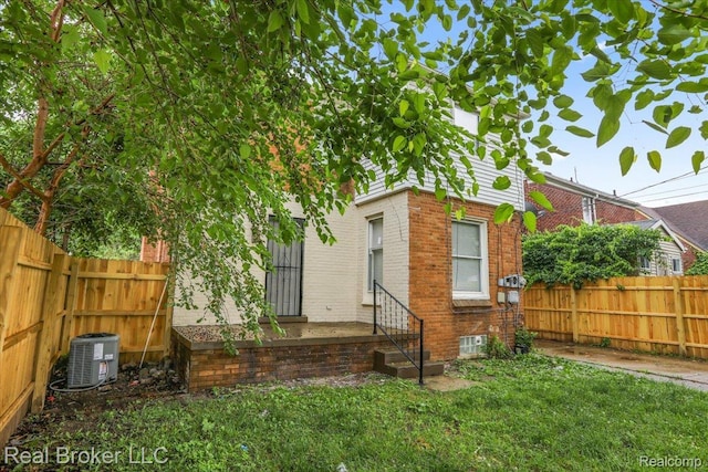 15873 Kentfield St, Dearborn, MI 48223 - back of house featuring brick siding and a fenced backyard