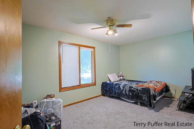 4651 Remembrance Rd NW, Grand Rapids, MI 49534 - carpeted bedroom with baseboards and ceiling fan