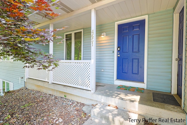4651 Remembrance Rd NW, Grand Rapids, MI 49534 - entrance to property featuring covered porch