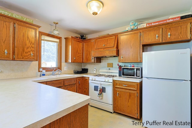 4651 Remembrance Rd NW, Grand Rapids, MI 49534 - kitchen featuring white appliances, light countertops, premium range hood, and brown cabinetry