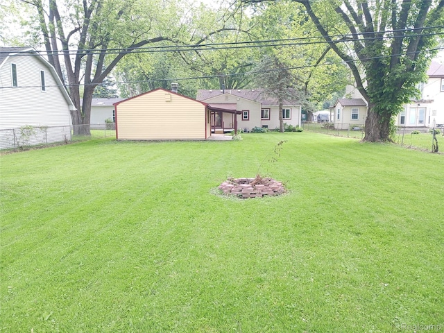 11132 Cape Cod St, Taylor, MI 48180 - fenced backyard with a fire pit