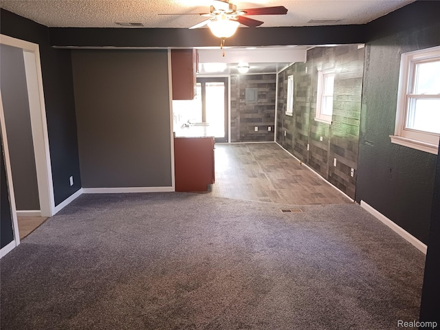 11132 Cape Cod St, Taylor, MI 48180 - unfurnished room with a ceiling fan, carpet flooring, and a textured ceiling