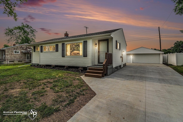 1006 Southlawn Ave, Flint, MI 48507 - view of front of home featuring a chimney, a garage, and an outbuilding