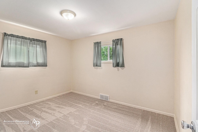 1006 Southlawn Ave, Flint, MI 48507 - carpeted empty room with baseboards