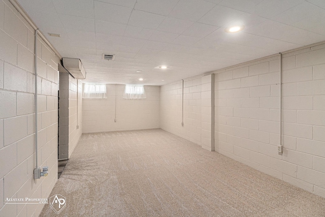 1006 Southlawn Ave, Flint, MI 48507 - below grade area featuring carpet, concrete block wall, and recessed lighting