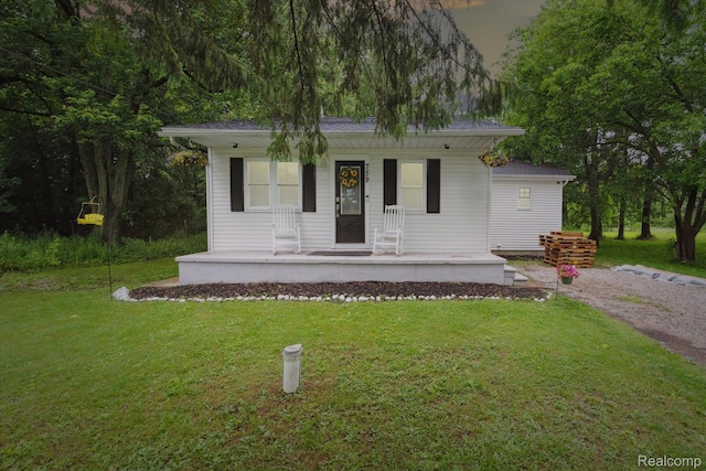 759 Elm St, Allenton, MI 48002 - view of front facade with covered porch and a front lawn