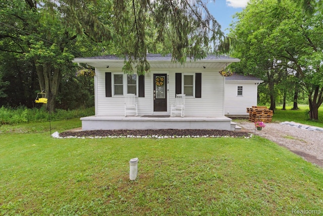 759 Elm St, Allenton, MI 48002 - view of front of property with covered porch and a front lawn