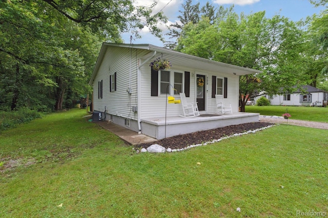 759 Elm St, Allenton, MI 48002 - view of front of house featuring covered porch and a front yard