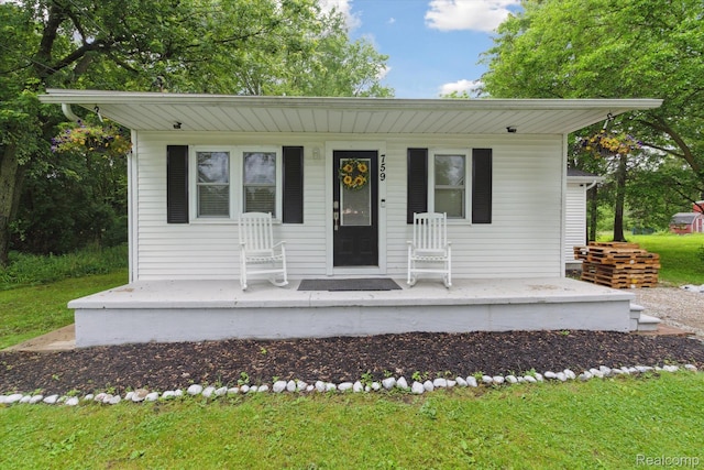 759 Elm St, Allenton, MI 48002 - view of front facade with a porch