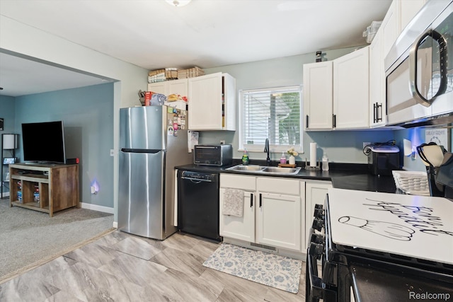759 Elm St, Allenton, MI 48002 - kitchen featuring black appliances, white cabinets, and dark countertops