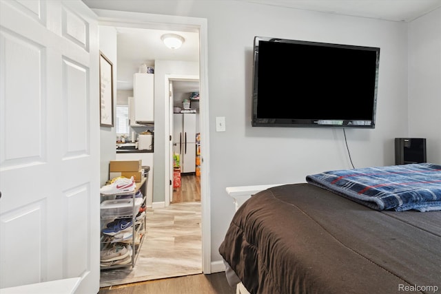 759 Elm St, Allenton, MI 48002 - bedroom featuring light wood-style flooring and baseboards